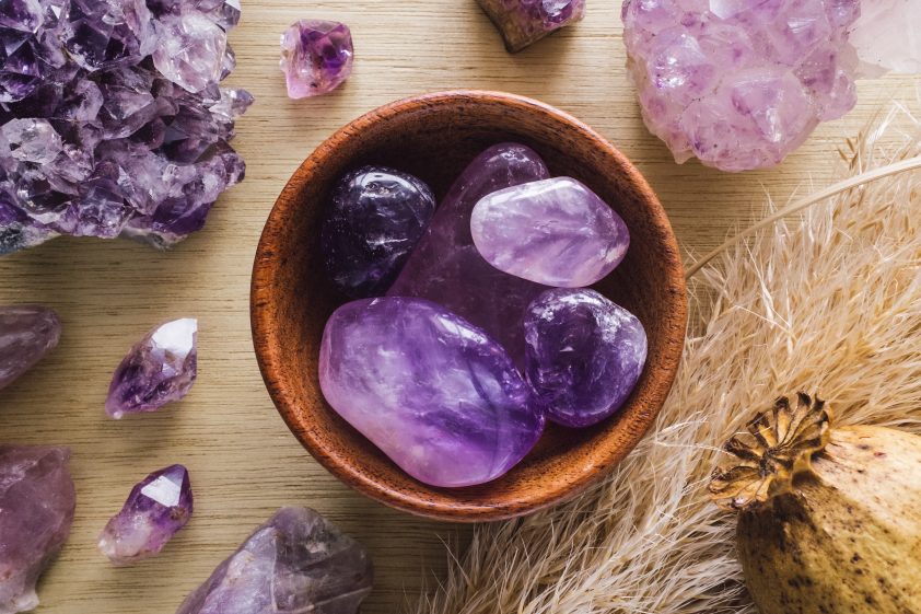 Bowl of Amethyst gemstones for cleansing and detoxifying