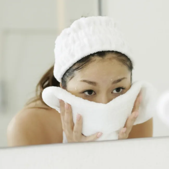 Korean washcloth on face