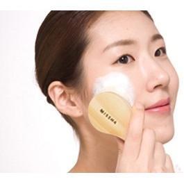 Korean woman brushing face